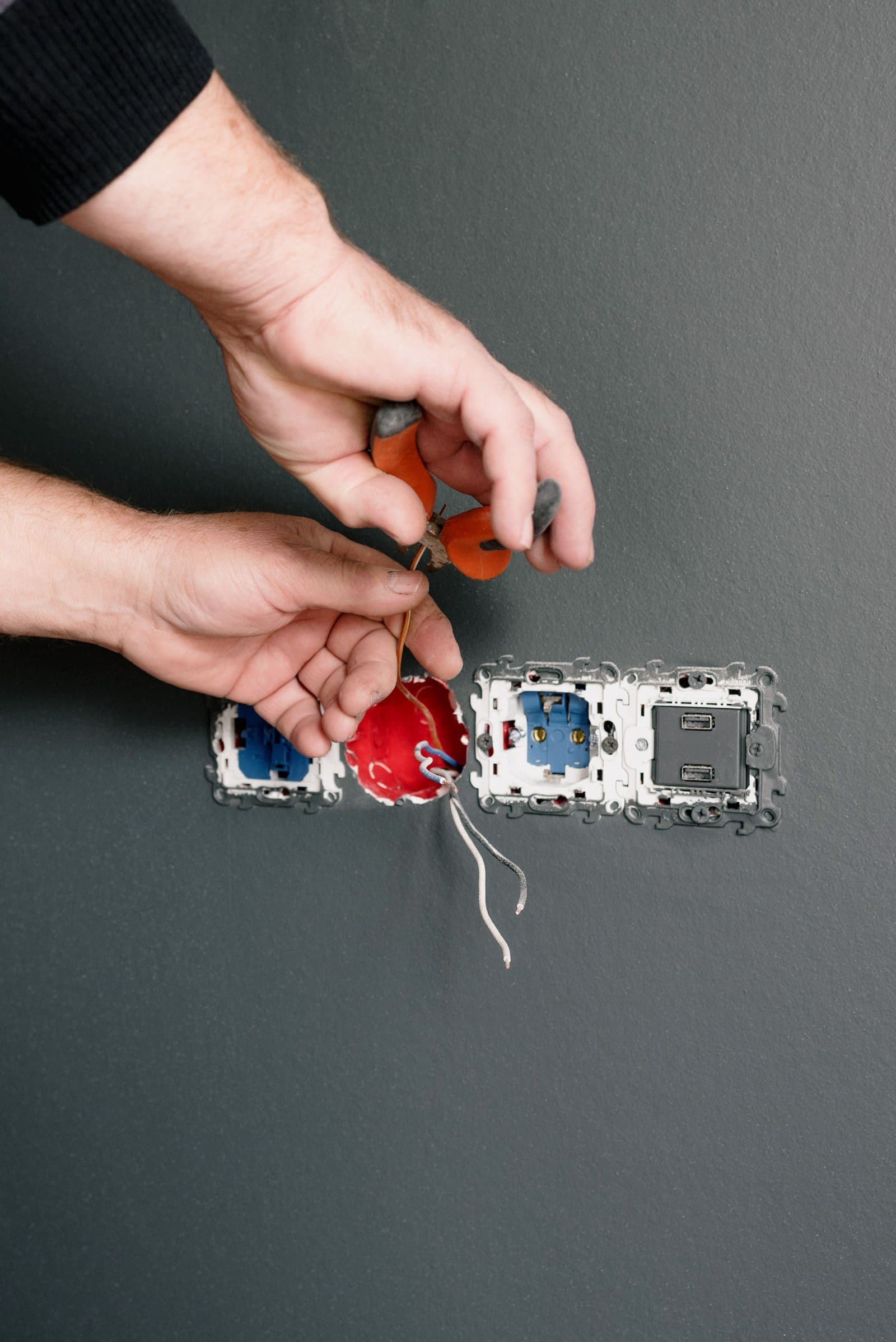 Electrician installing power points and switches inside a home